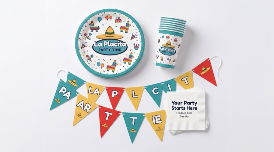 Party supplies including plates, cups, banners and decorations